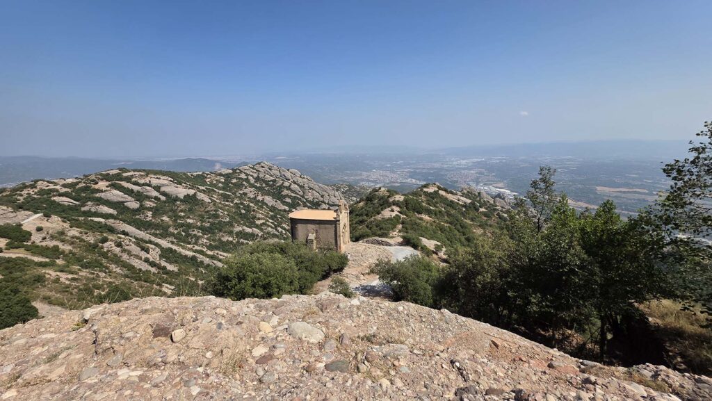 This image features the Ermita de Sant Joan, a chapel located in the Montserrat mountain range near Barcelona, Spain